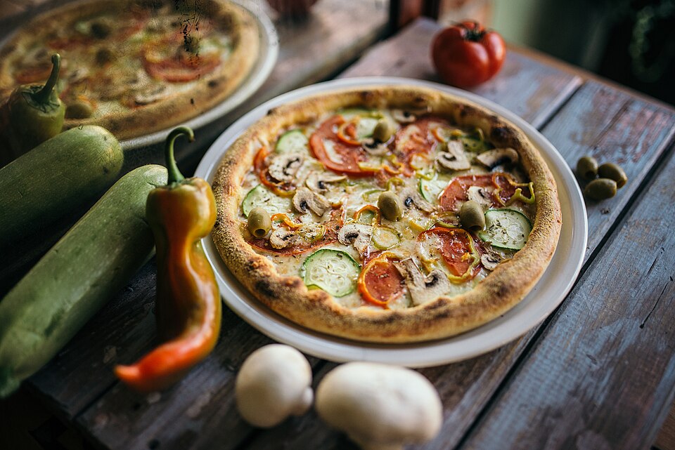 Vegetable pizza with mushrooms and olives